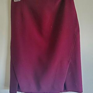 Burgundy fitted knee high skirt.
